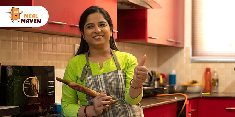 Indian housewife using a laptop at home to run her business